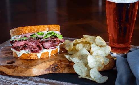 Barbecued sandwich paired with beer